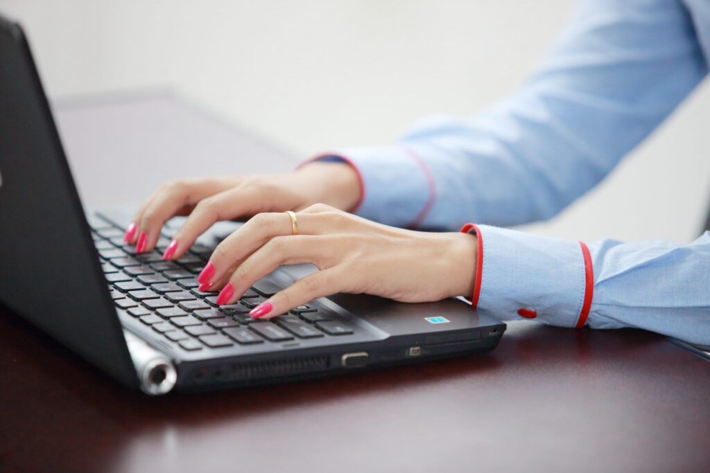 Working at a laptop in the IGS Consulting office